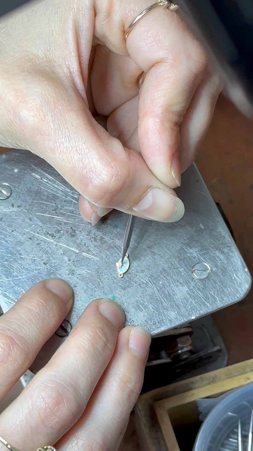 Handwork on a jewelry detail at the Henia Danielle workbench