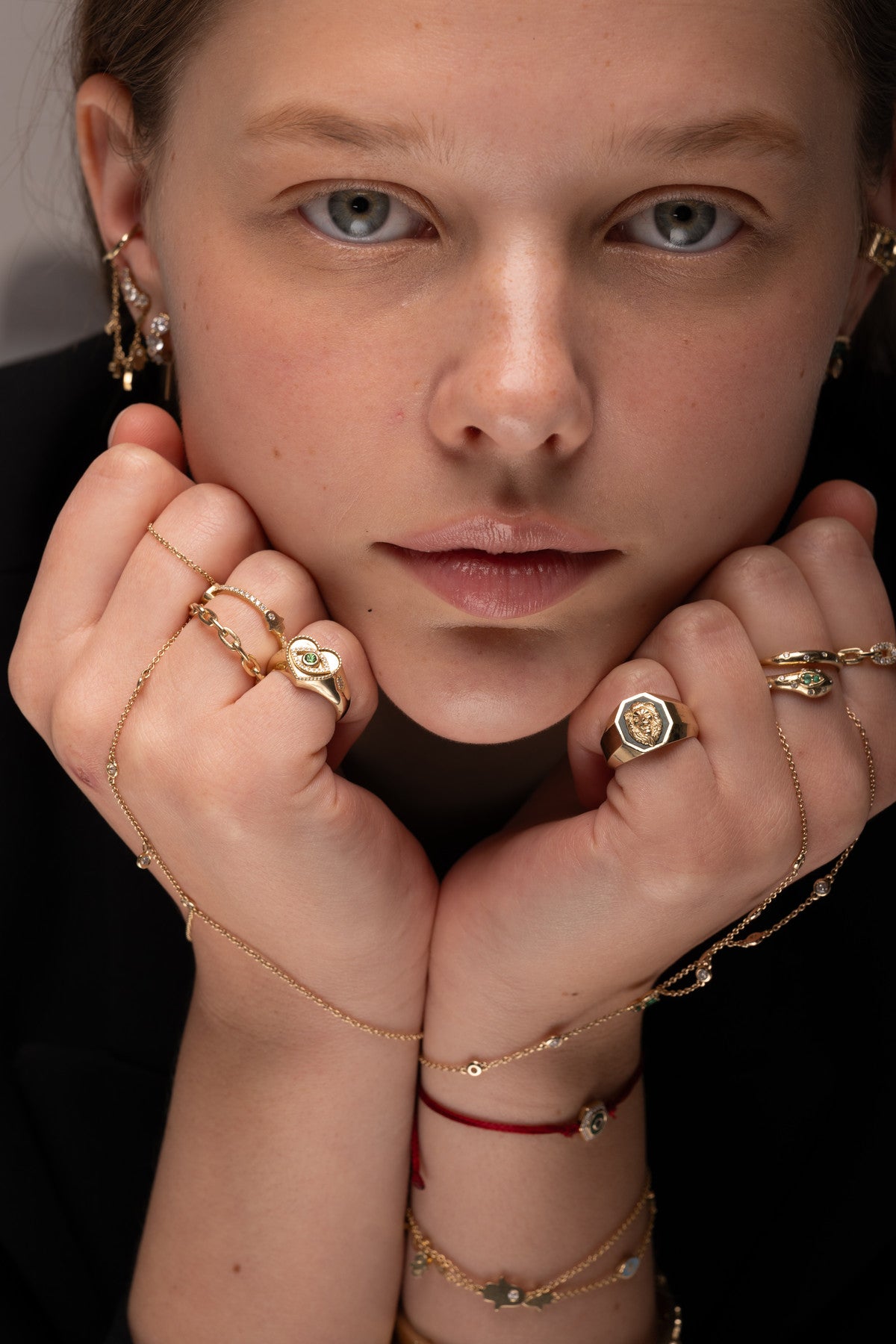 Henia Danielle on Instagram: sculptural gold rings, earrings and hand chains styled with a black jacket